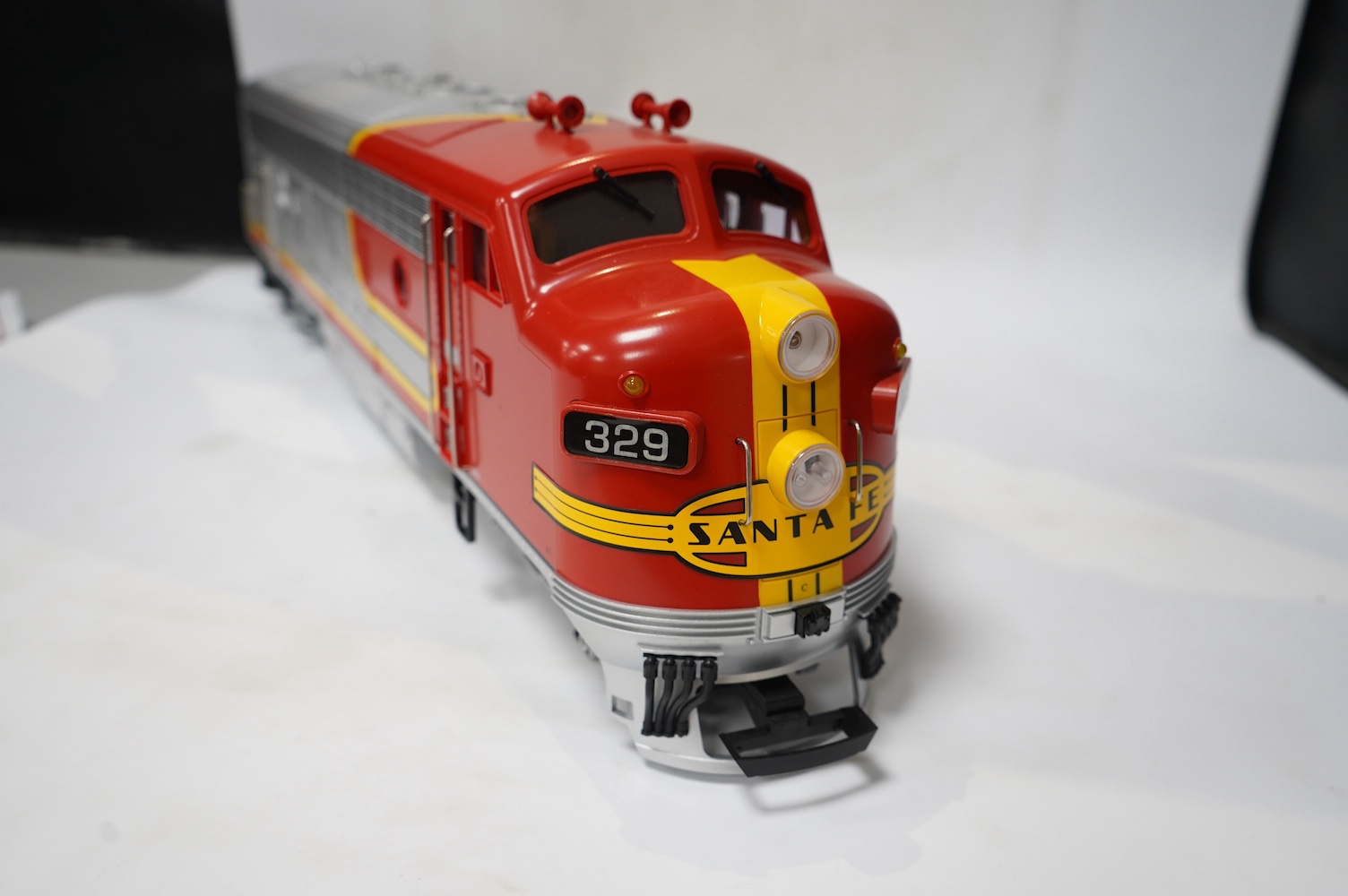 A boxed Lehman LGB (20570) G scale railway Santa Fe Bo-Bo diesel locomotive, 329, in red and silver livery. Condition - good, evidence of very minor running wear only.